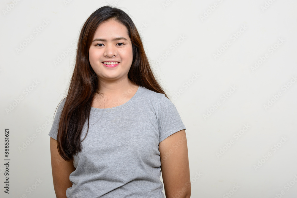 Portrait of happy young beautiful Asian woman Portrait of happy young beautiful Asian woman