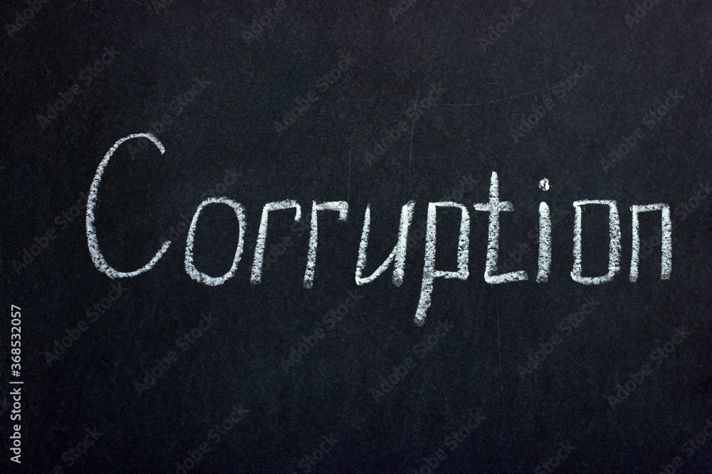 Fototapeta premium Chalkboard lettering Corruption. Reflection of urgent problems of society