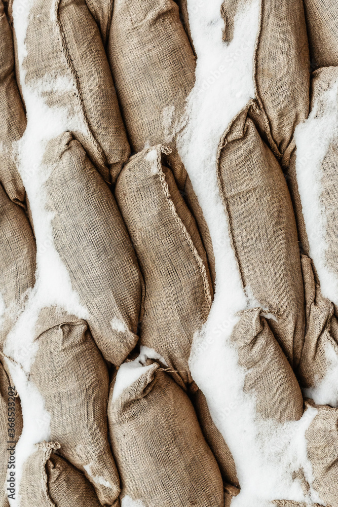 Obraz premium Many gray sandbag. Pattern closeup vertical background protection military design base