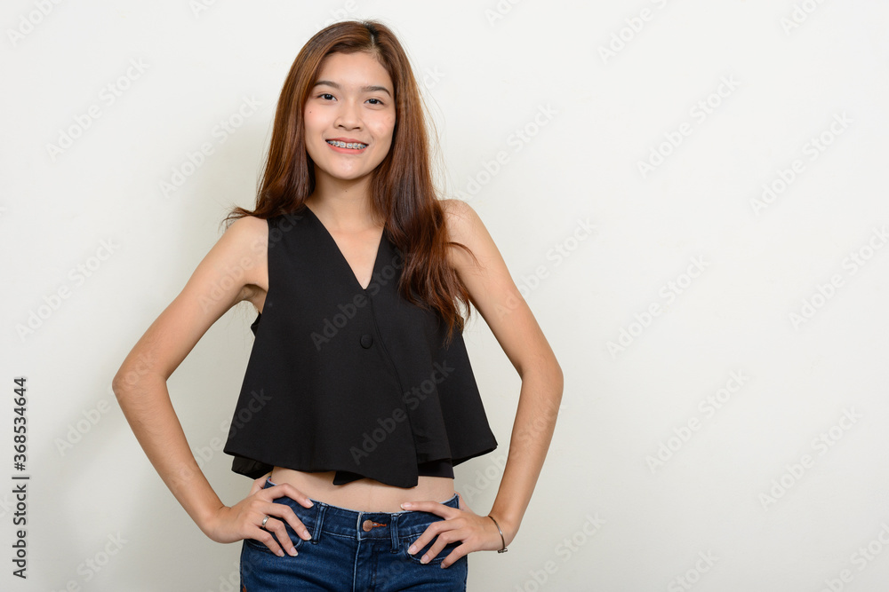 Portrait of happy young beautiful Asian woman Portrait of happy young beautiful Asian woman