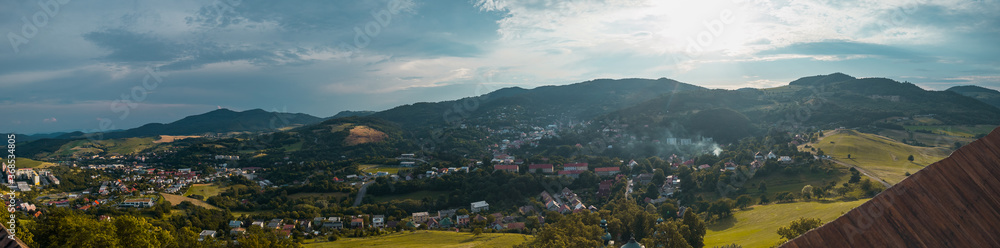 Panorama from the top of Banska Stiavnica Cavalry in central Slovakia during afternoon hours with overview of the city.