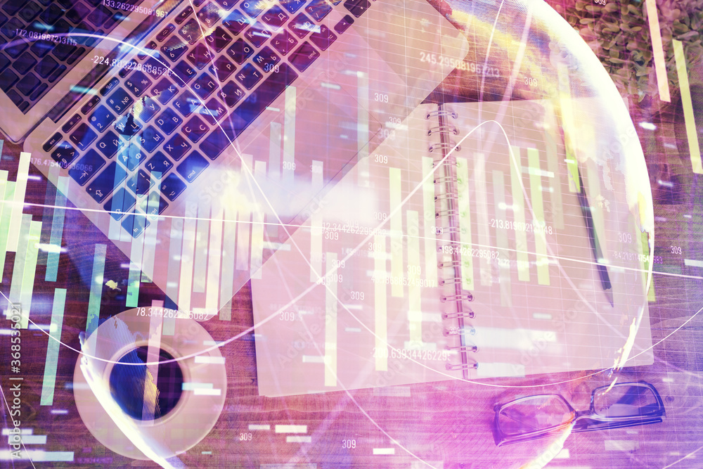 Business theme hologram drawings over computer on the desktop background. Top view. Multi exposure. Concept of international connections. Business theme hologram drawings over computer on the desktop background. Top view. Multi exposure. Concept of international connections.