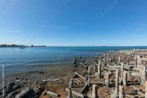 Ruins of structural columns that have been destroyed at the coast.