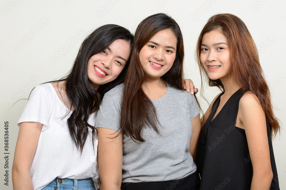 Portrait of three young Asian women as friends together Portrait of three young Asian women as friends together