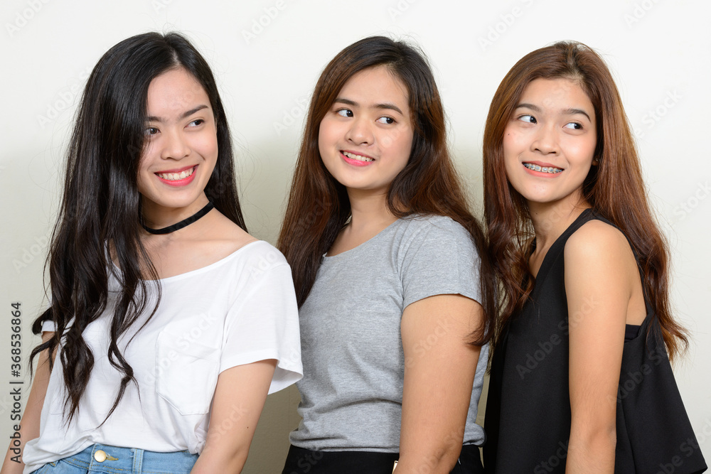 Portrait of three young Asian women as friends together Portrait of three young Asian women as friends together