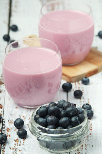 Two glasses with blueberry yogurt 