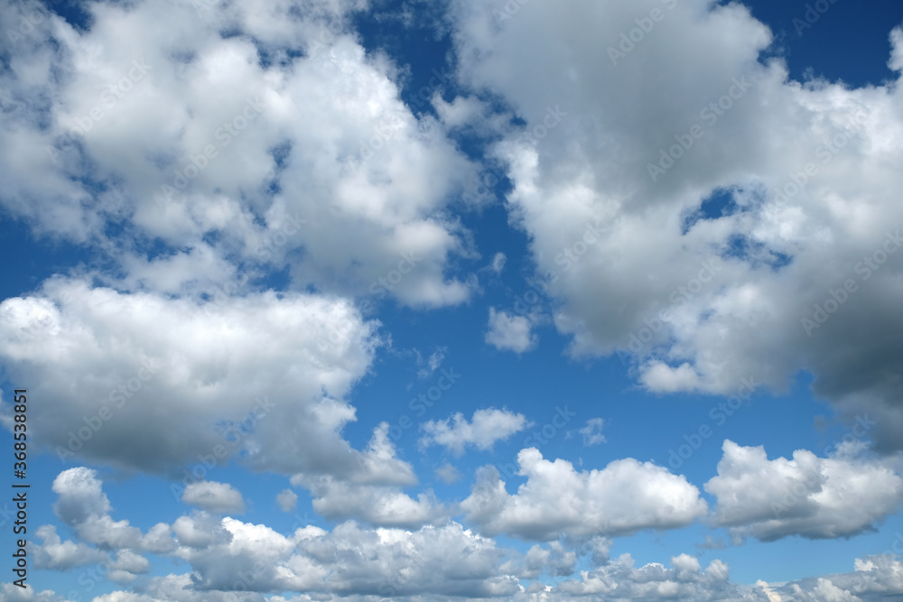 Beautiful heaven landscape with white and gray clouds on bright sunny day horizontal view Beautiful heaven landscape with white and gray clouds on bright sunny day horizontal view