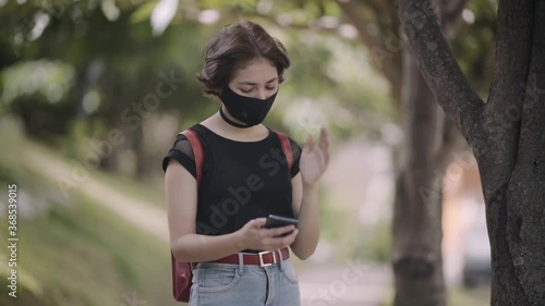 Middle shot of a teenager waiting for her friends
