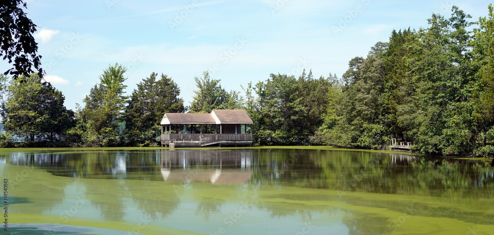 Pavilion  fishing shelter on lake.
