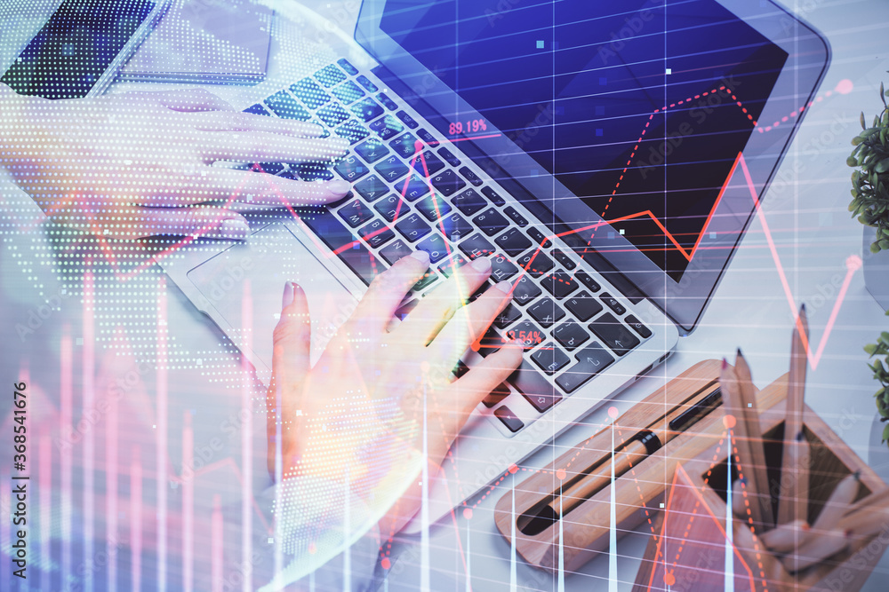 Multi exposure of woman hands typing on computer and forex chart hologram drawing. Stock market analysis concept. Multi exposure of woman hands typing on computer and forex chart hologram drawing. Stock market analysis concept.