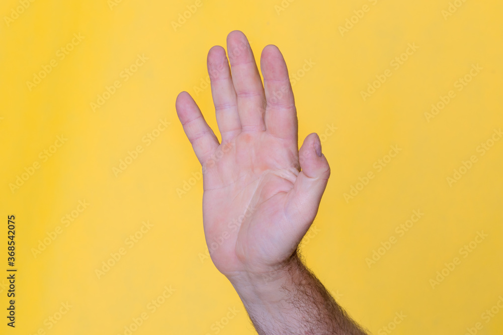 Naklejka premium Man hand showing sign Stop 