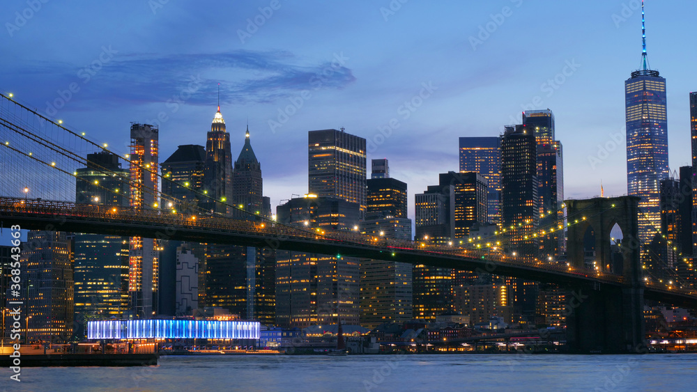 landscape of lower manhattan with Brooklyn bridge  east river at night time
