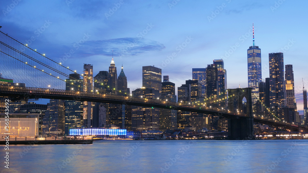 landscape of lower manhattan with Brooklyn bridge  east river at night time