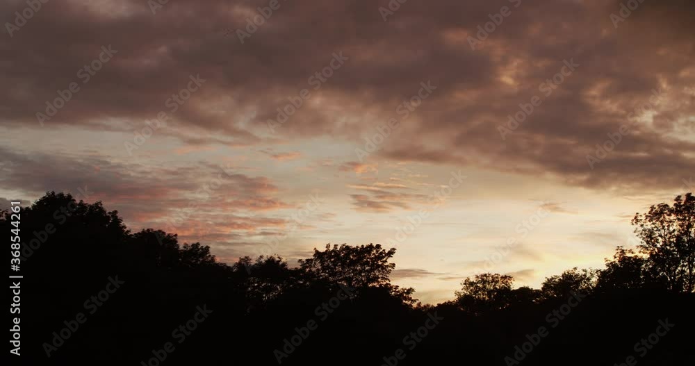 Sky With Clouds at Sunset With Silhouettes of Trees, Time Lapse.
Beautiful orange sky with fast moving clouds at sunset. Background Day Night Dramatic Sunset Sky Red Purple Cloud Sunset Sky. Sky With Clouds at Sunset With Silhouettes of Trees, Time Lapse.
Beautiful orange sky with fast moving clouds at sunset. Background Day Night Dramatic Sunset Sky Red Purple Cloud Sunset Sky.