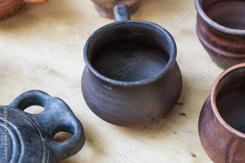dark brown and black clay pot, traditional country housewares close-up © Kai Beercrafter