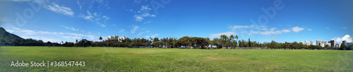 Kapiolani Park at during day with Diamond Head and clouds