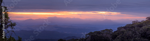 Panoramic Rainforest Sunset with Misty Valley View