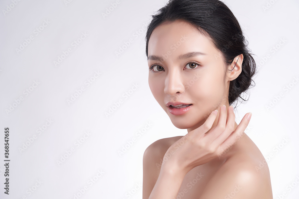 Beautiful Young asian Woman with Clean Fresh Skin on white background, Face care, Facial treatment, Cosmetology, beauty and spa, Asian women portrait Beautiful Young asian Woman with Clean Fresh Skin on white background, Face care, Facial treatment, Cosmetology, beauty and spa, Asian women portrait