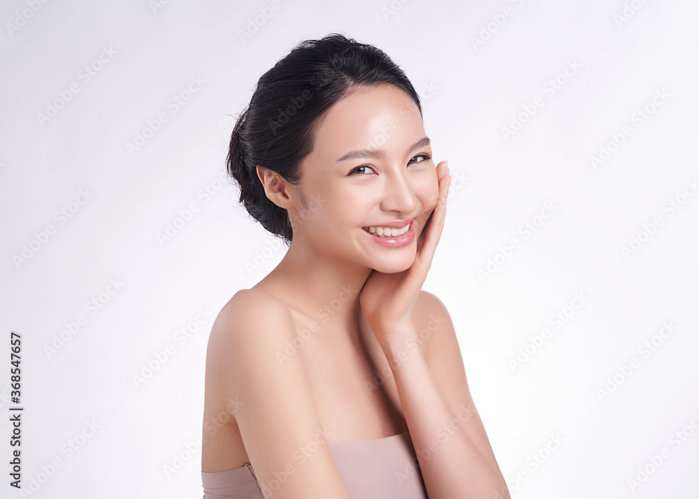 Beautiful Young asian Woman with Clean Fresh Skin on white background, Face care, Facial treatment, Cosmetology, beauty and spa, Asian women portrait Beautiful Young asian Woman with Clean Fresh Skin on white background, Face care, Facial treatment, Cosmetology, beauty and spa, Asian women portrait