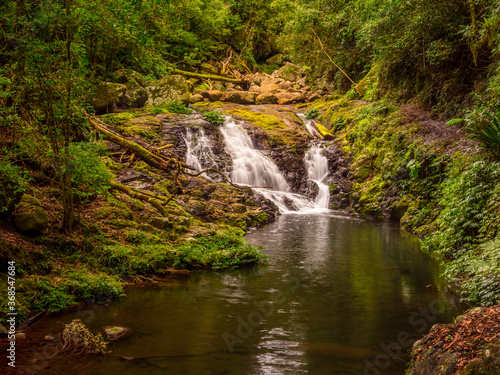 Fototapeta Naklejka Na Ścianę i Meble -  Rainforest Cascade with Reflections