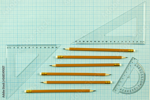 set of stationery for design and drawing. simple pencil, set of rulers and protractor. place for text