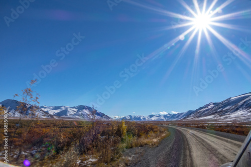 Dempster Highway Looking out at the road ahead in Fall sunshine Yukon