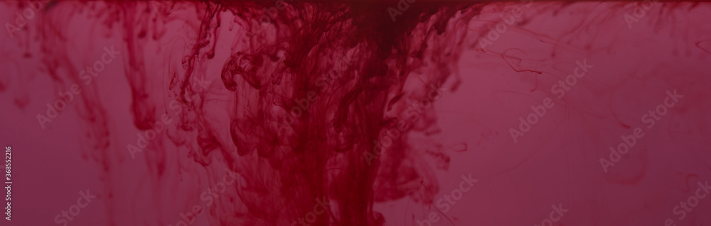 Purple-pink ink dripping in water, gradually cracking according to scientific movements. Purple-pink ink dripping in water, gradually cracking according to scientific movements.