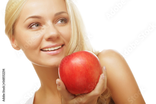 woman with an apple ahainst white background photo