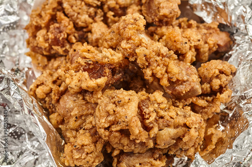 Photography Deep fried chicken gizzards, an American soul food classic, shown here wrapped f