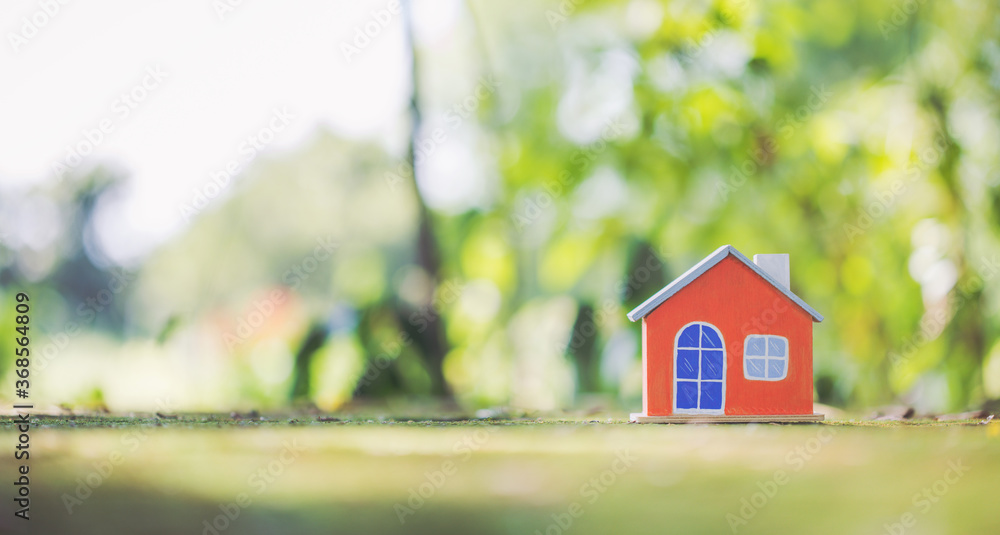 Wooden Orange house model on moss. Wooden Orange house model on moss.