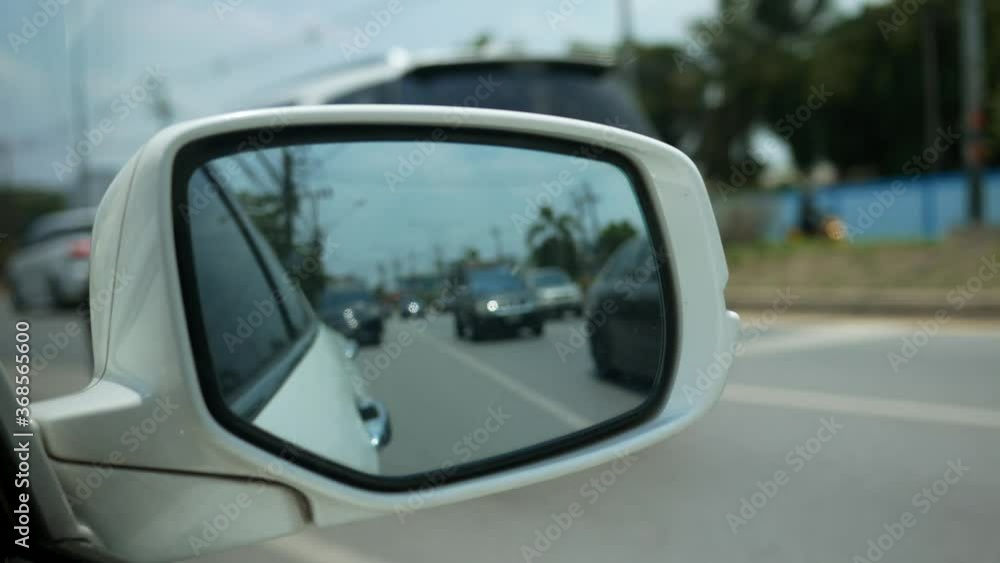 car side rear view mirror on the street. car side rear view mirror on the street.