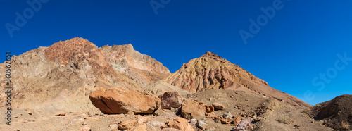 Boulders Washed Down the Aluvial Fan On the Multi-Colored Mountains of Artist's Palette, Death Valley National Park, California, USA