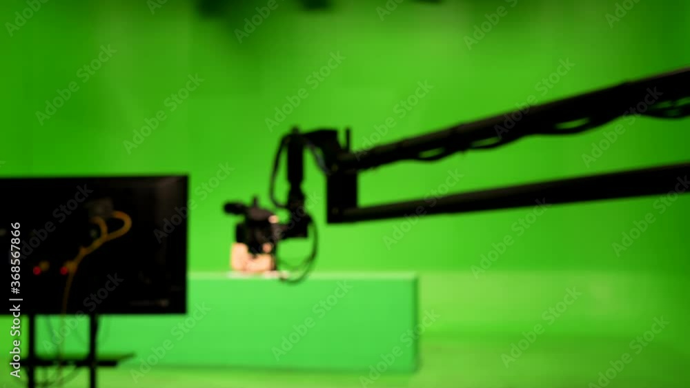 abstract blurred of broadcast camera in studio with virtual greenscreen at TV station. abstract blurred of broadcast camera in studio with virtual greenscreen at TV station.