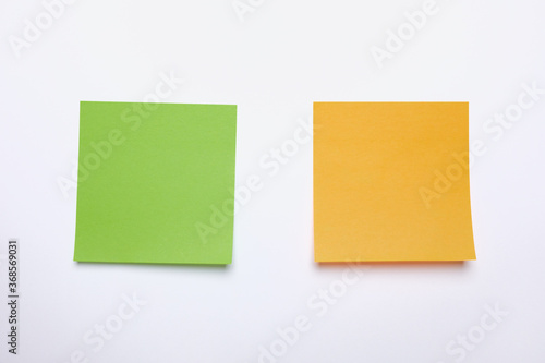 Two yellow sticky notes reminders on a white background