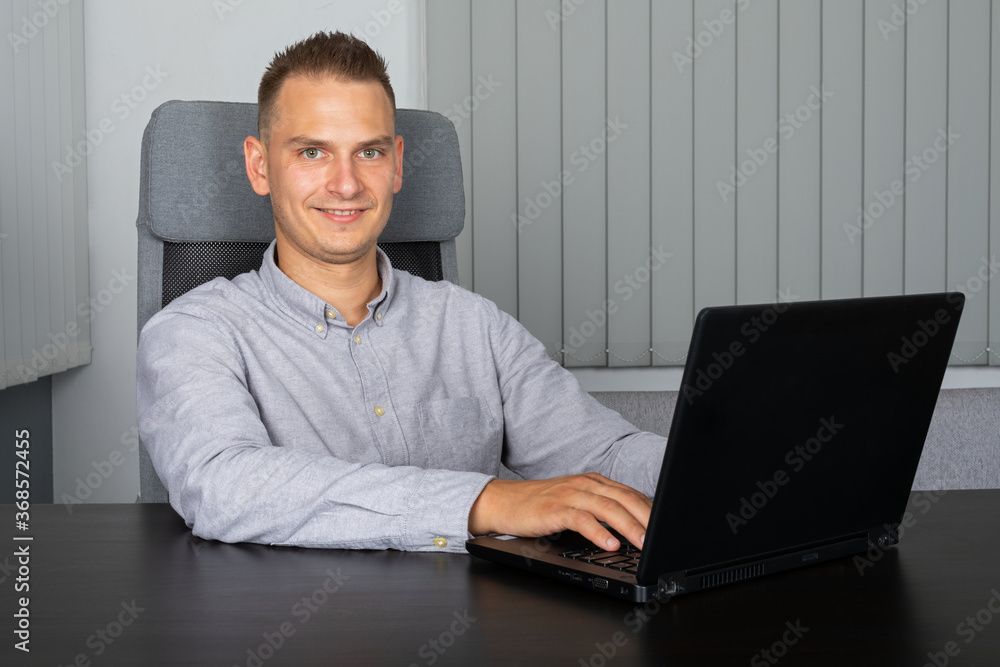 Confident businessman in office Confident businessman in office