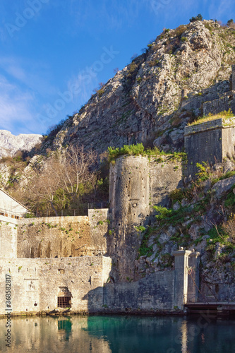  Montenegro. Fortress of Old Town of Kotor.  View of southern walls and Gurdiс Gate on sunny winter day photo