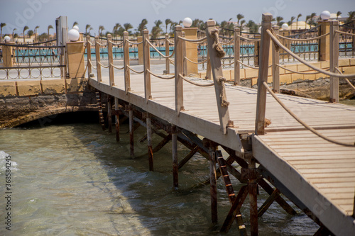 wooden pier to the clear sea