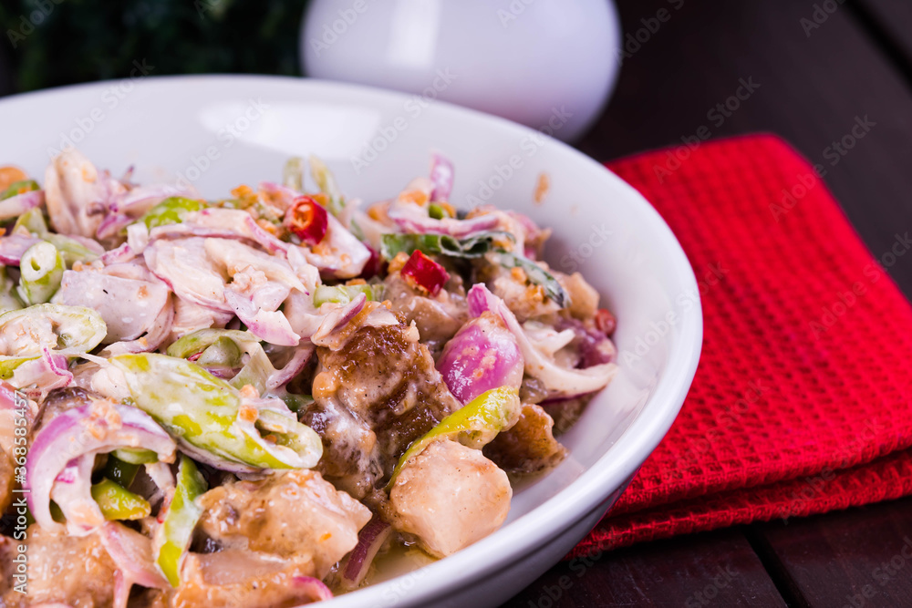 crispy pork belly in savory mayonnaise with fresh red onions and green chilli crispy pork belly in savory mayonnaise with fresh red onions and green chilli
