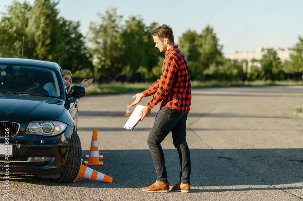 Female student knocks down traffic cone Female student knocks down traffic cone