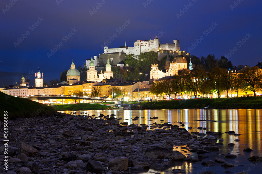 Beautiful view of Salzburg skyline with Festung Hohensalzburg and Salzach river at twilight, Salzburg, Salzburger Land, Austria.