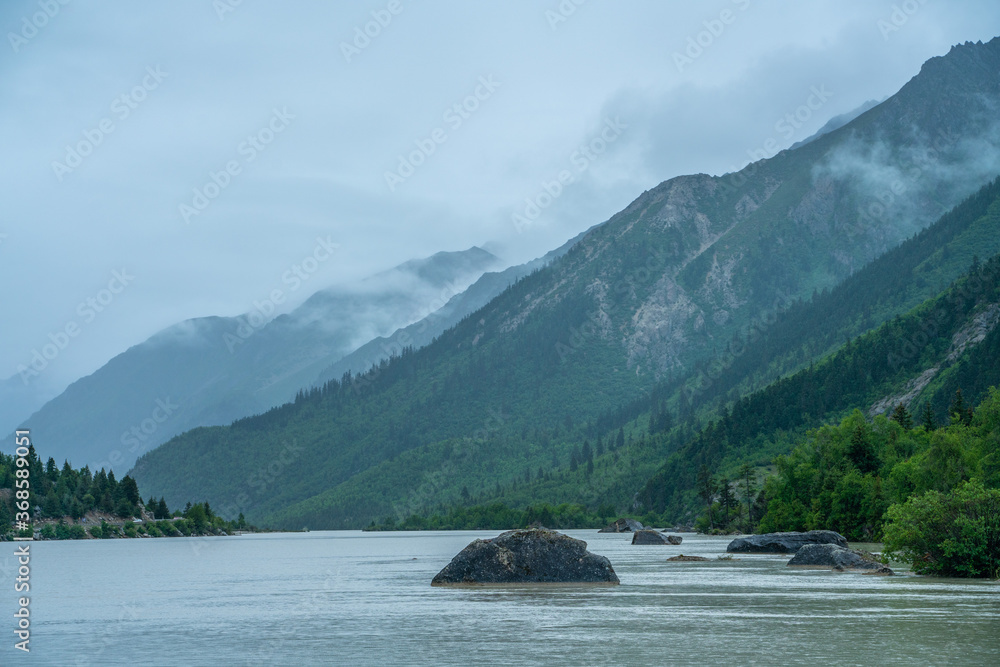 Ranwu lake, a sacred lake in Tibet, on cloudy day, summer time. Ranwu lake, a sacred lake in Tibet, on cloudy day, summer time.