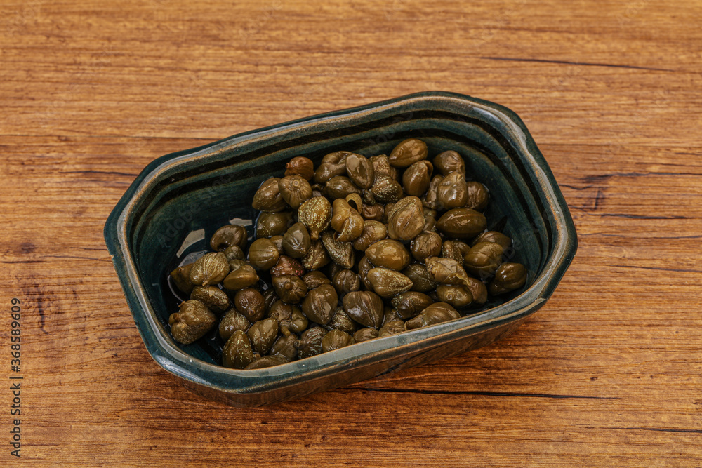 Tasty capers in the bowl Tasty capers in the bowl