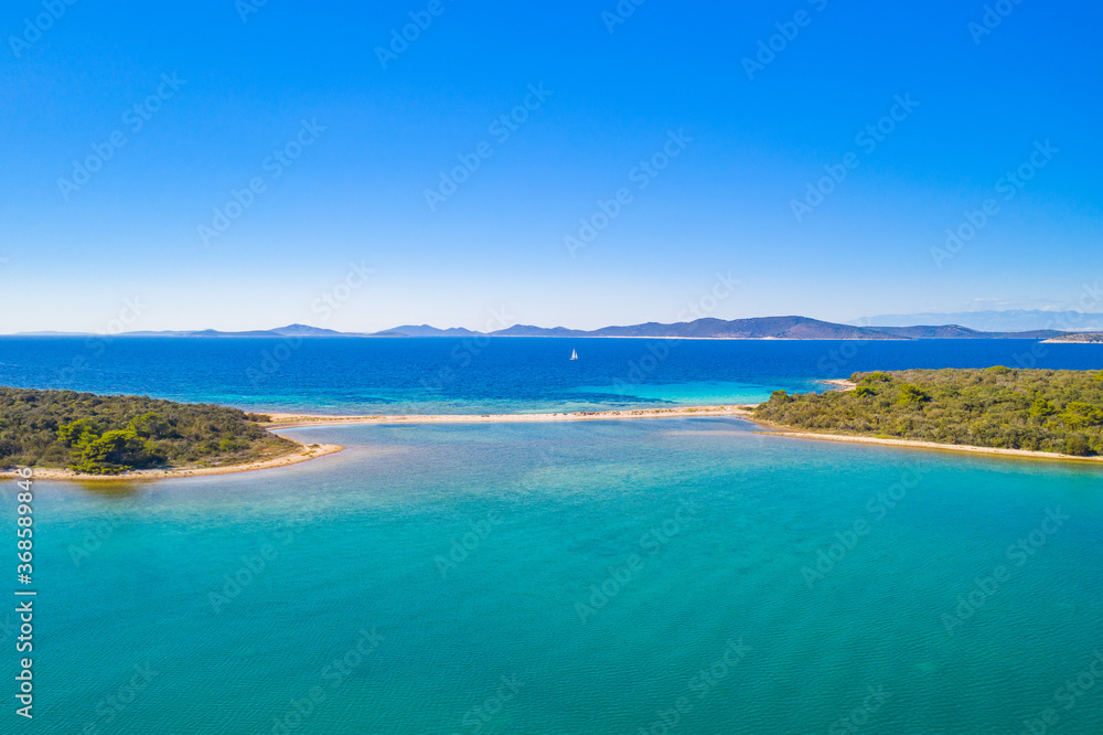 Amazing islands with natural bridge in turquoise sea on the island of Dugi Otok in Croatia, Adriatic sea, drone aerial view