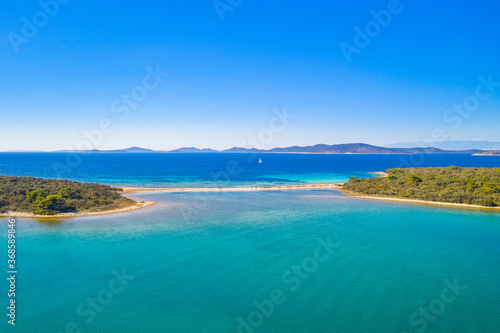 Amazing islands with natural bridge in turquoise sea on the island of Dugi Otok in Croatia, Adriatic sea, drone aerial view