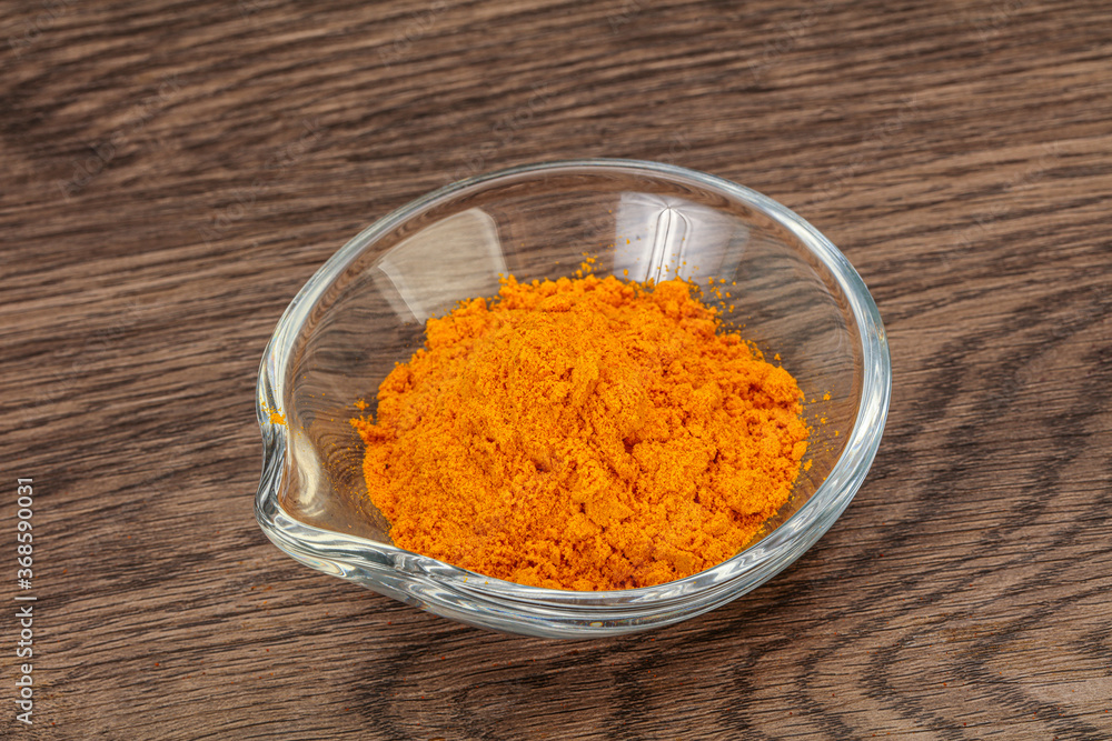 Tumeric powder in the bowl Tumeric powder in the bowl