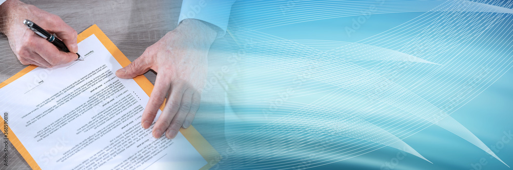 Hand of businessman signing a document; panoramic banner Hand of businessman signing a document; panoramic banner