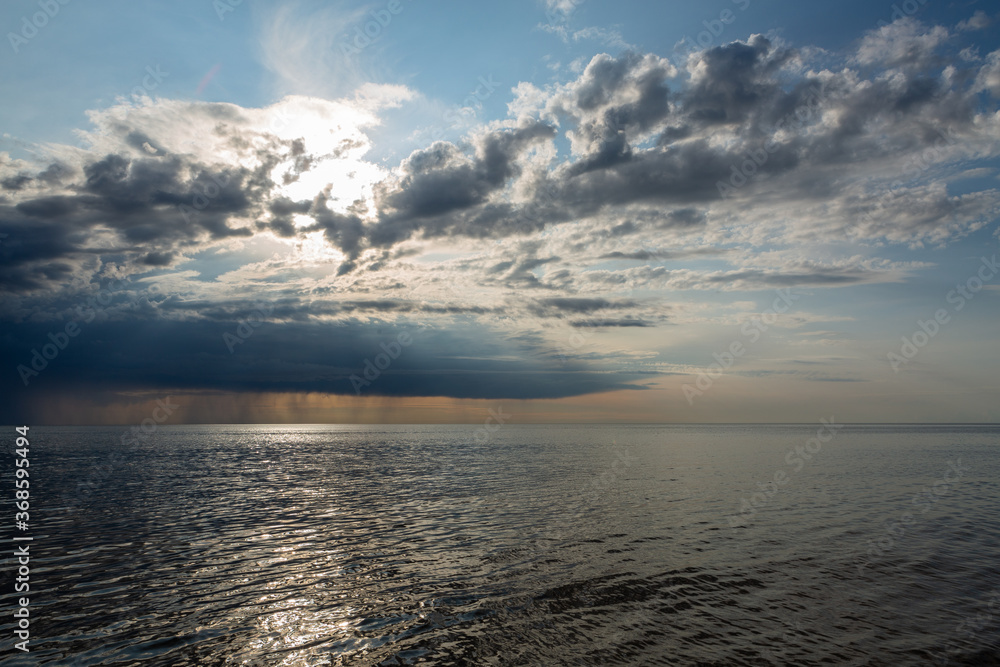 Fototapeta premium Clouds before the rain in the sea