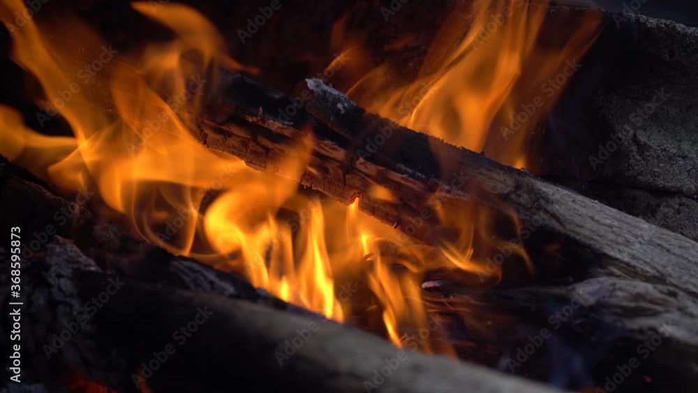 Burning fire, firewood coal close up in the fireplace Burning fire, firewood coal close up in the fireplace