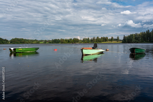 Boats and boat moorings on the river © EriksZ