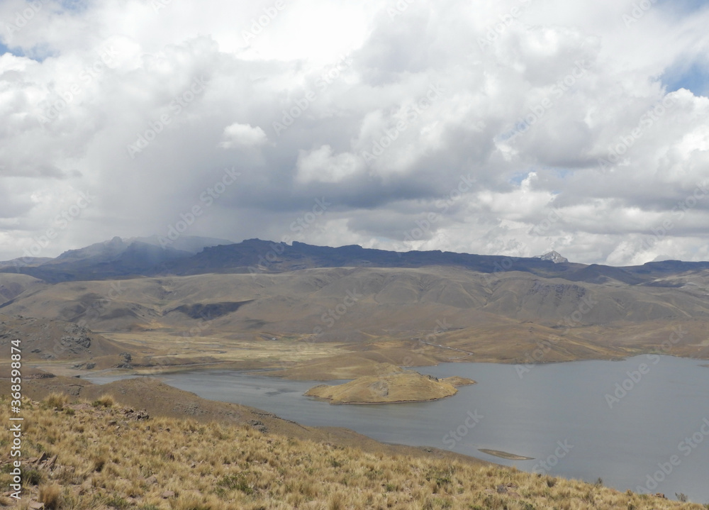 Lake in the mountains under a very cloudy sky Lake in the mountains under a very cloudy sky